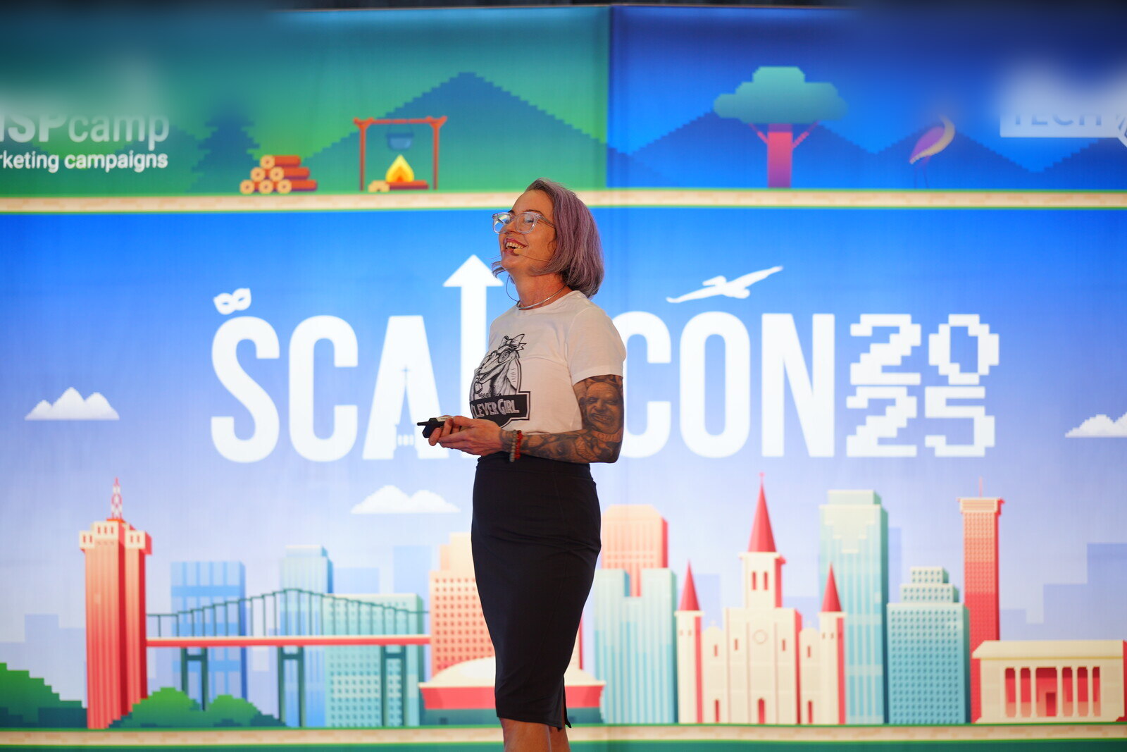 Carrie Richardson speaking on stage at ScaleCon25