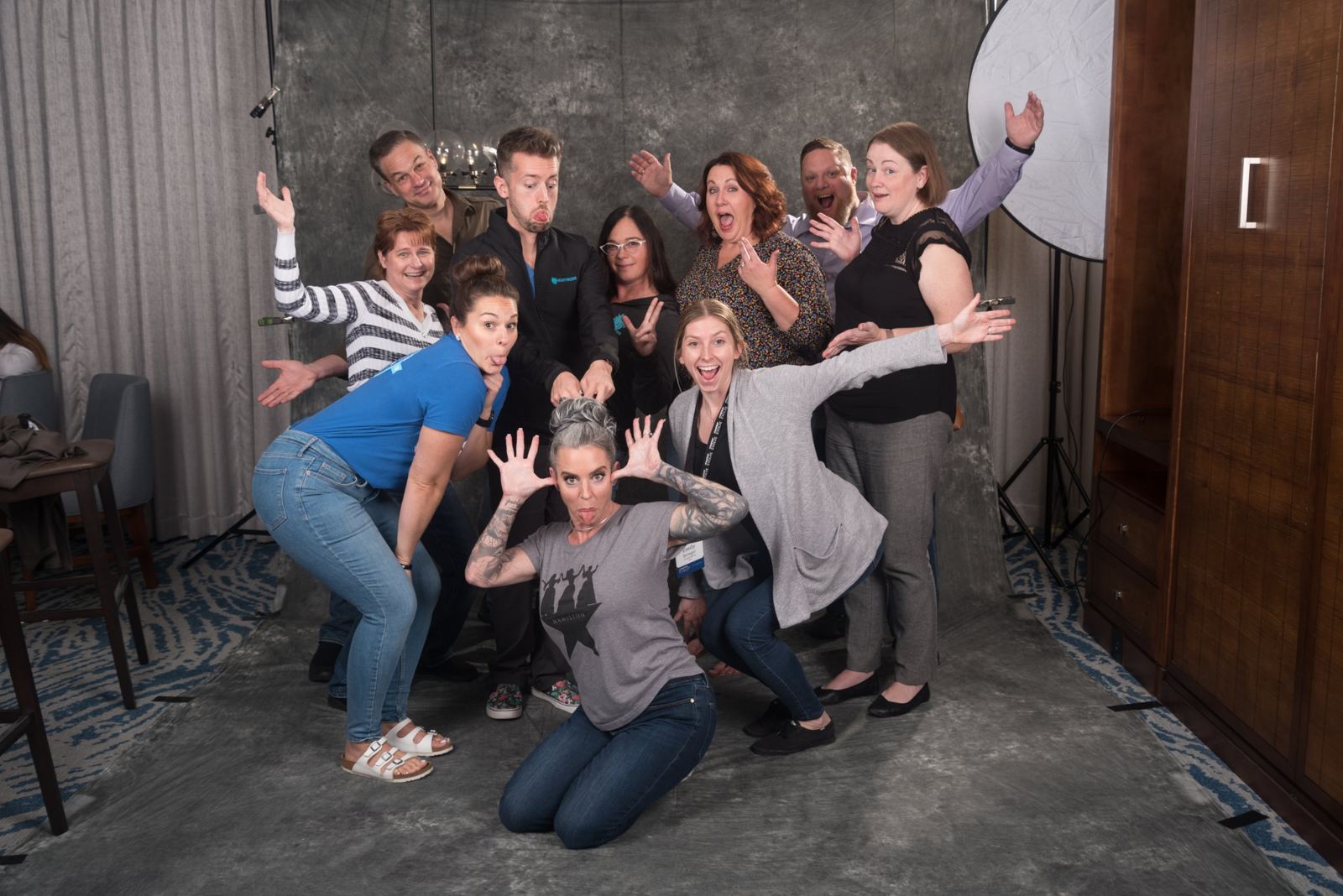 A group of friends making faces at the photo booth