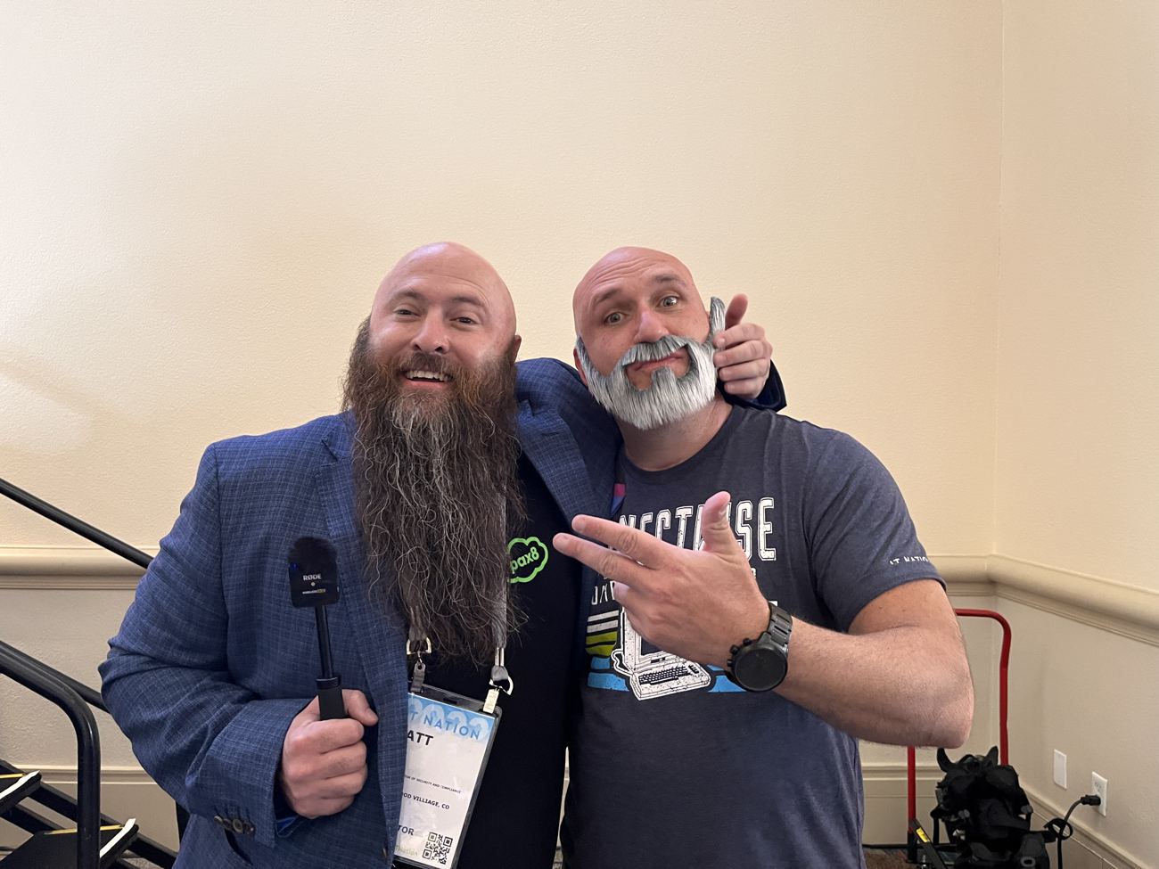 A friend with a very long beard next to a friend in a fake gray beard