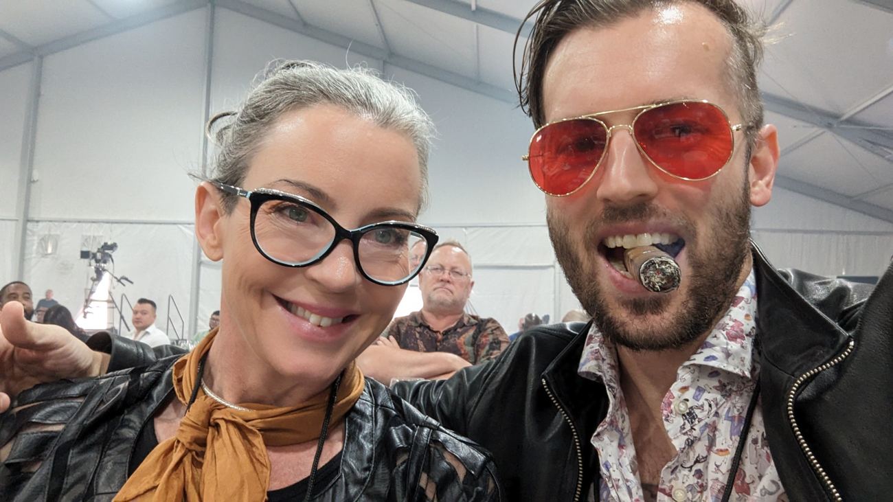 Carrie and Ian, Ian in red aviators with a cigar in his teeth