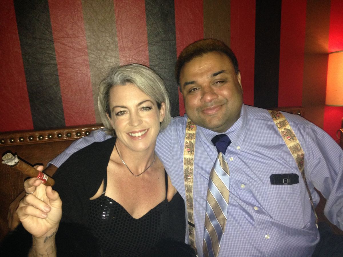 A cigar and a friend on a leather banquette