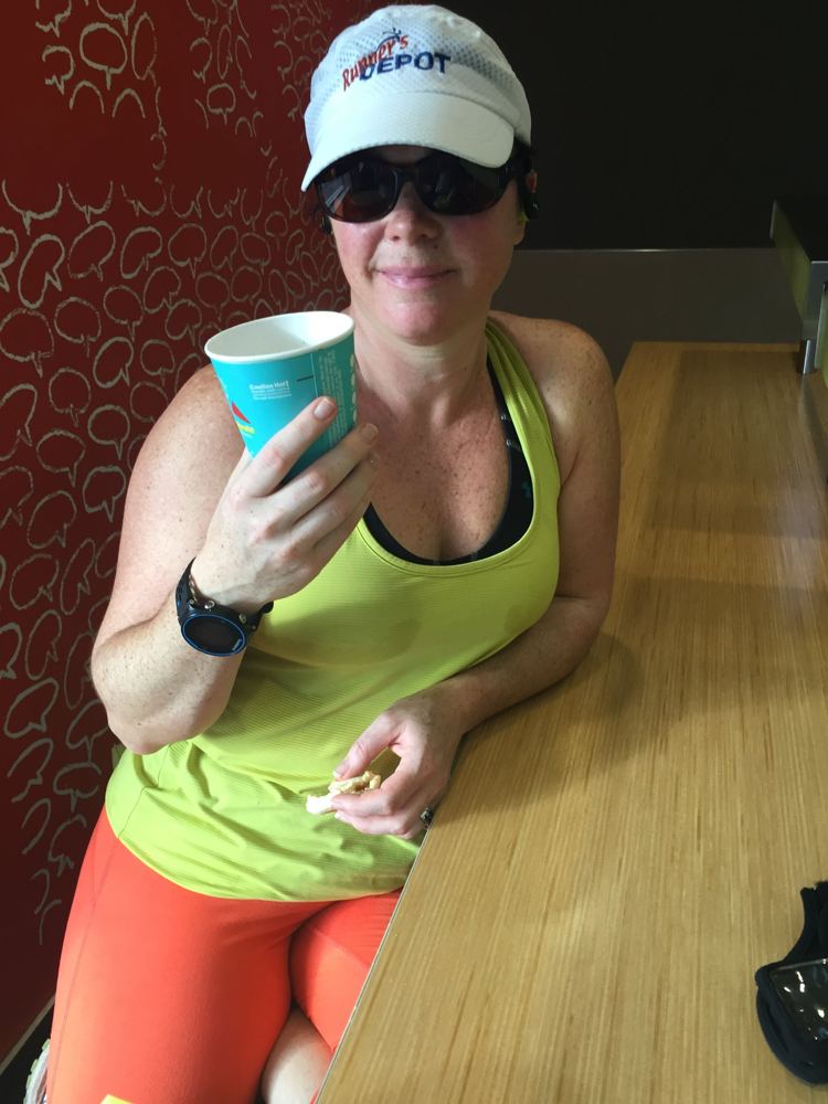 Mid-race coffee and a breakfast sandwich in running gear