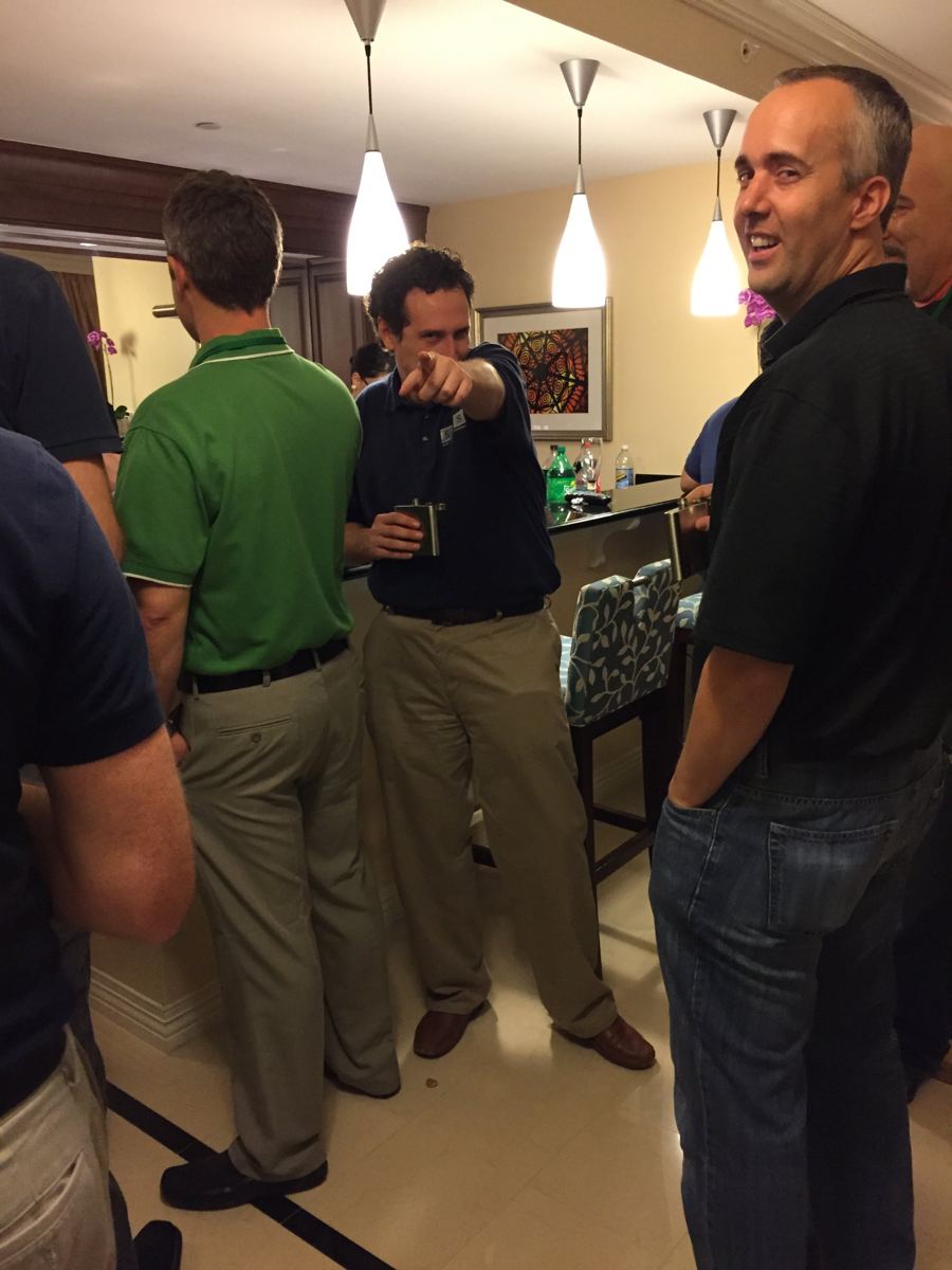 The suite packed with friends holding flasks
